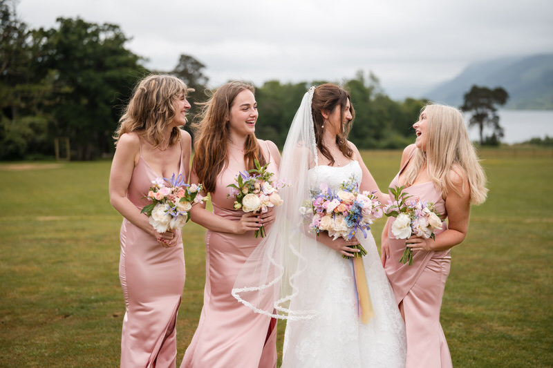 Bride and bridesmaids portrait on the grounds at Armathwaite Hall