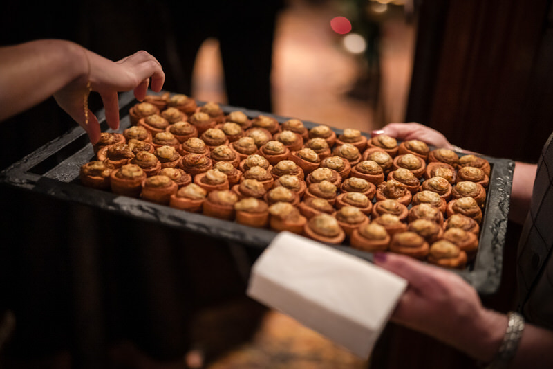 Wedding guests enjoying food and conversation during a Lake District reception