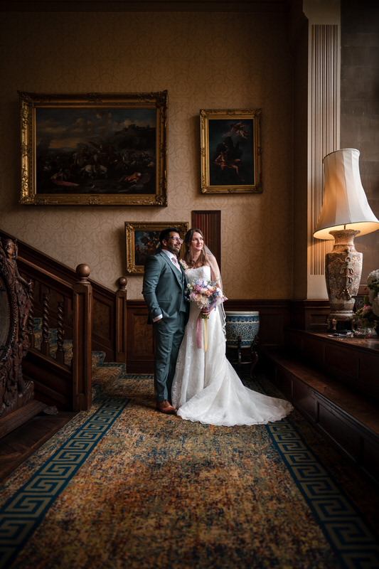 Wedding couple portrait on an interior staircase at Armathwaite Hall