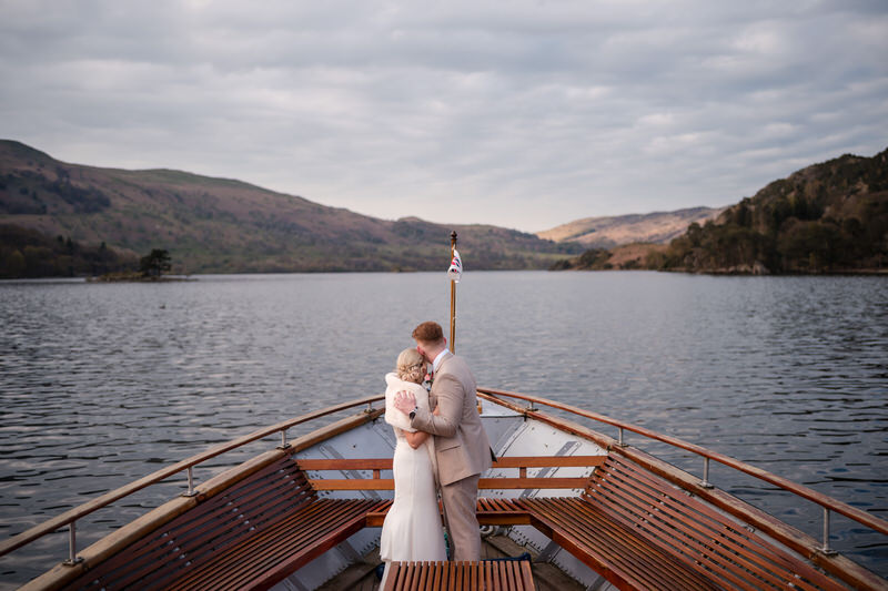 Wedding couple boat portrait on Ullswater at Inn on the Lake
