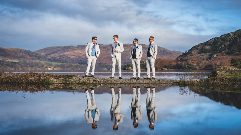 Groomsmen portrait with Ullswater landscape at Inn on the Lake wedding venue