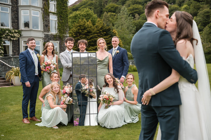 Creative wedding party mirror portrait in the garden at Inn on the Lake