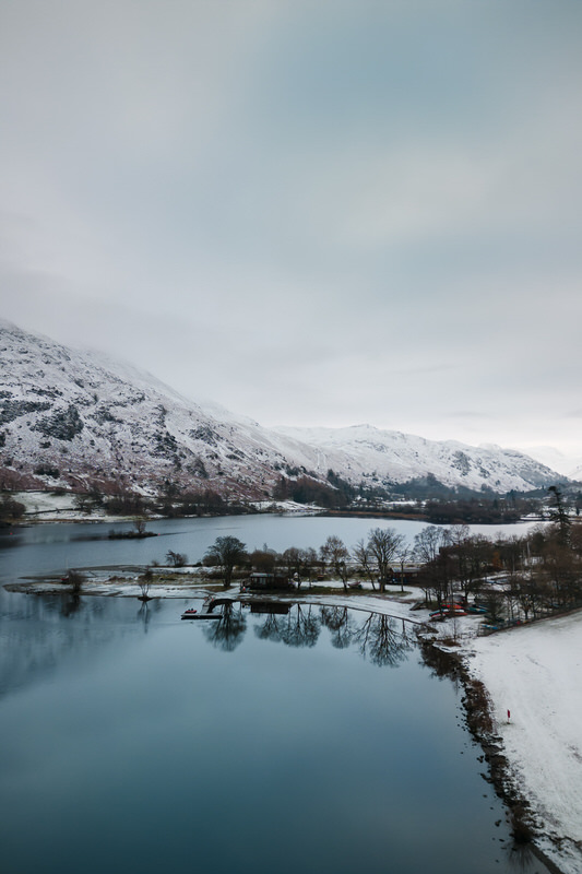 Winter view of Ullswater and snowy fells from Inn on the Lake