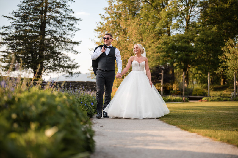 Wedding couple walking in the gardens at Lodore Falls Hotel