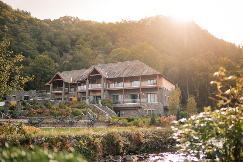 Modern exterior of Lodore Falls Hotel with woodland backdrop