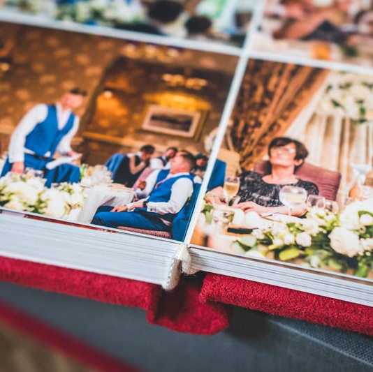 Lay-flat wedding album pages showing print detail