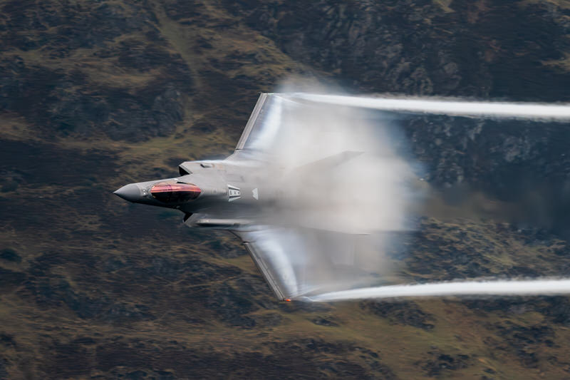 Low-level aircraft producing dramatic vapour over the Lake District