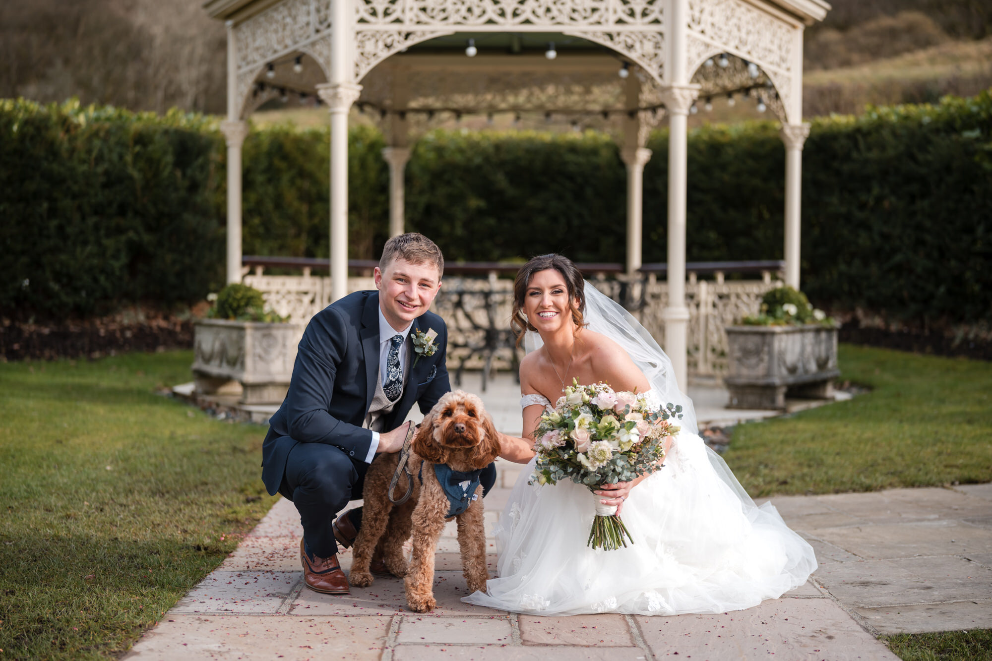 Bride and groom with their dog at a dog friendly Lake District wedding