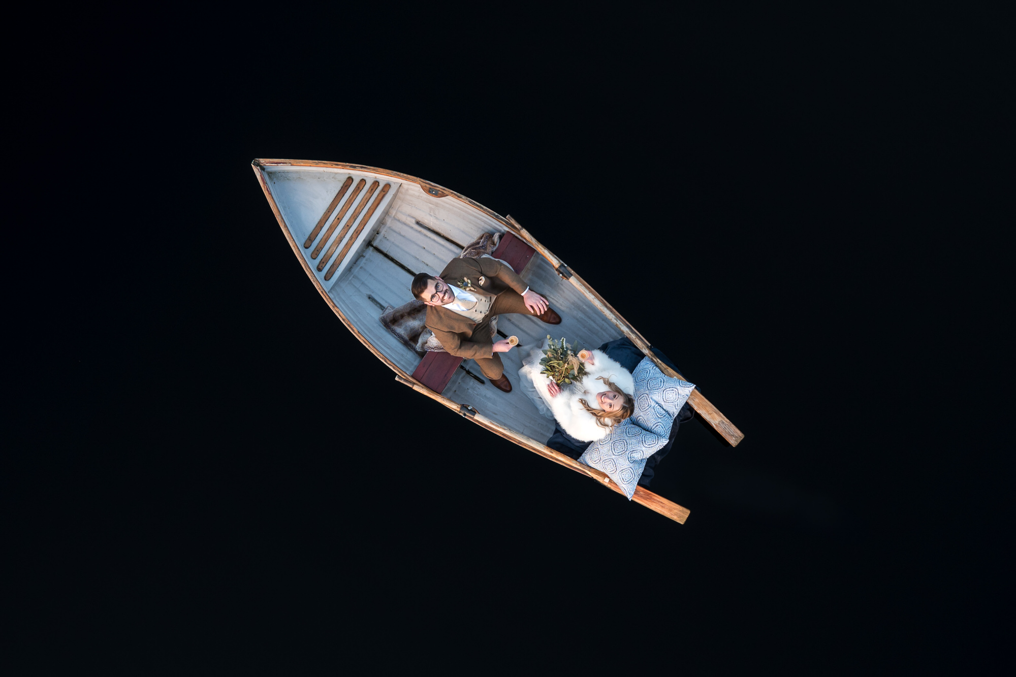 Drone view of a wedding couple in a rowing boat at Gilpin Lake House