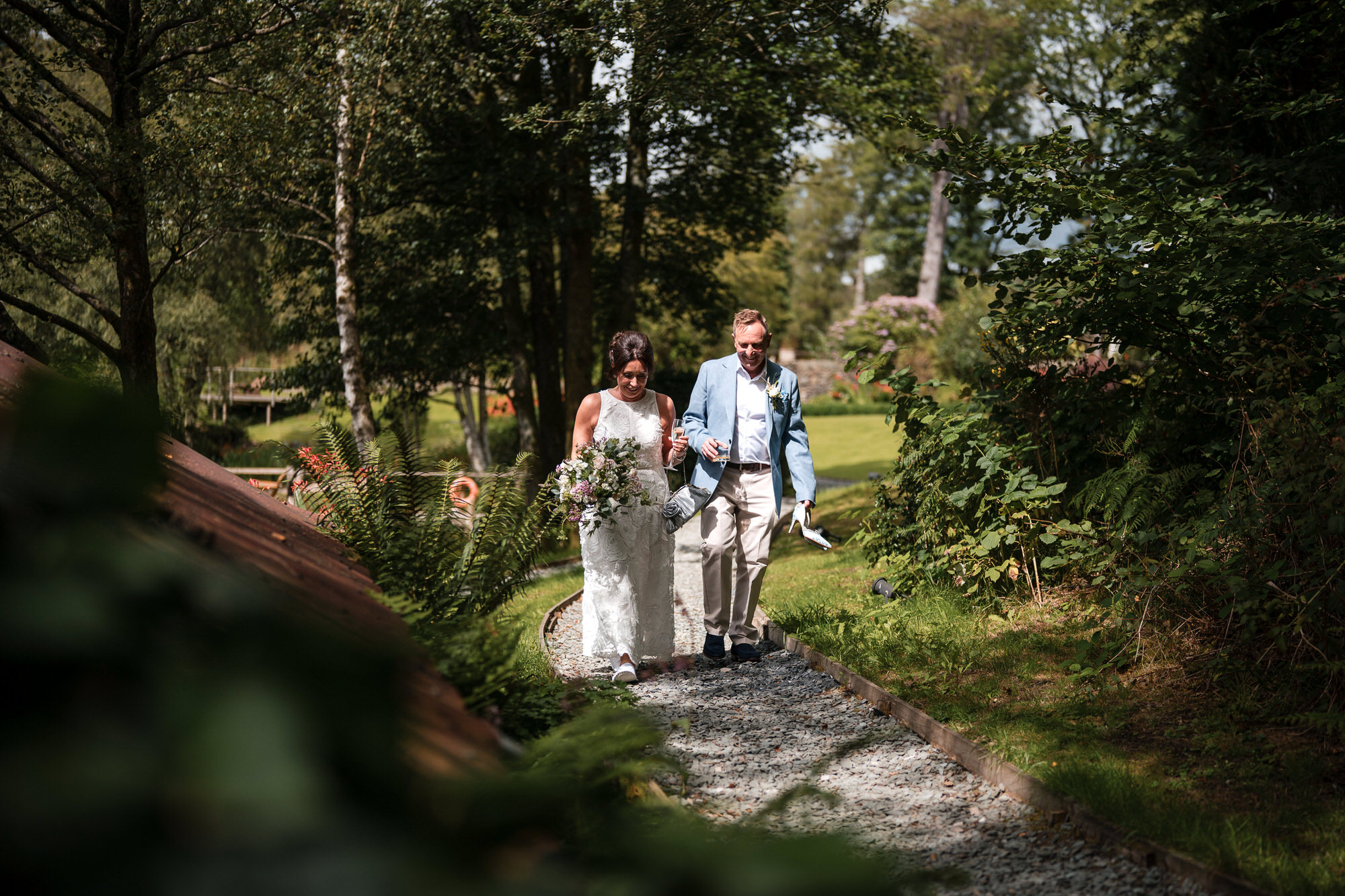 Wedding couple walking through the grounds at Gilpin Lake House