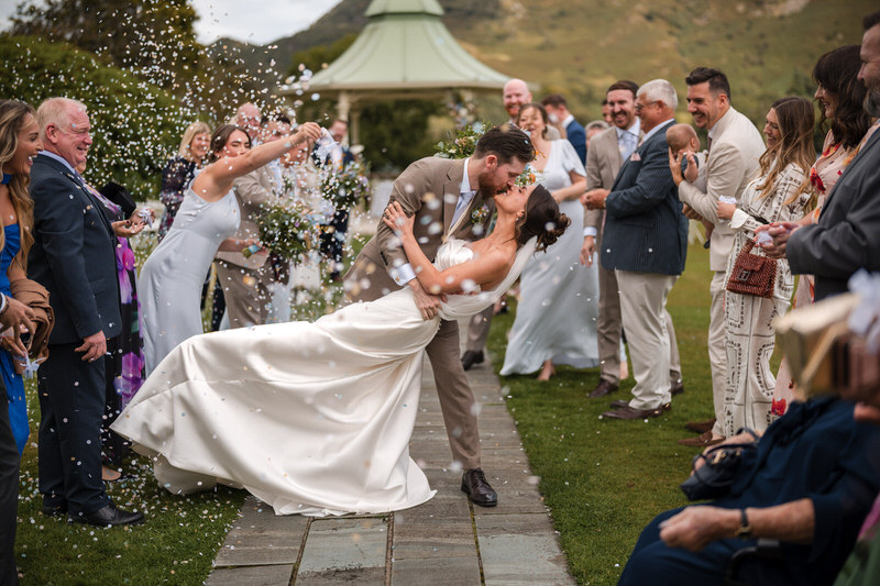 Bride and groom dip kiss moment captured as part of a wedding highlight film