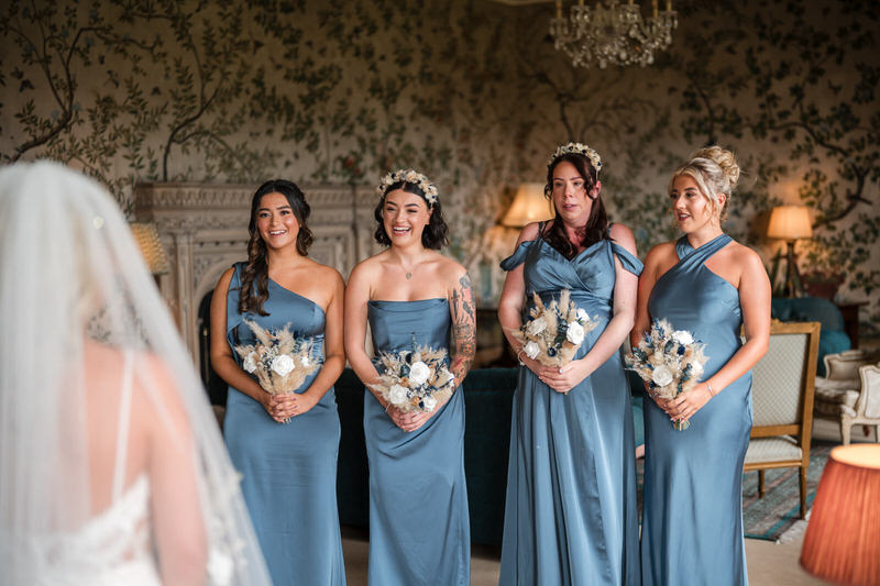 First look with the bridesmaids captured on a Lake District wedding highlight film