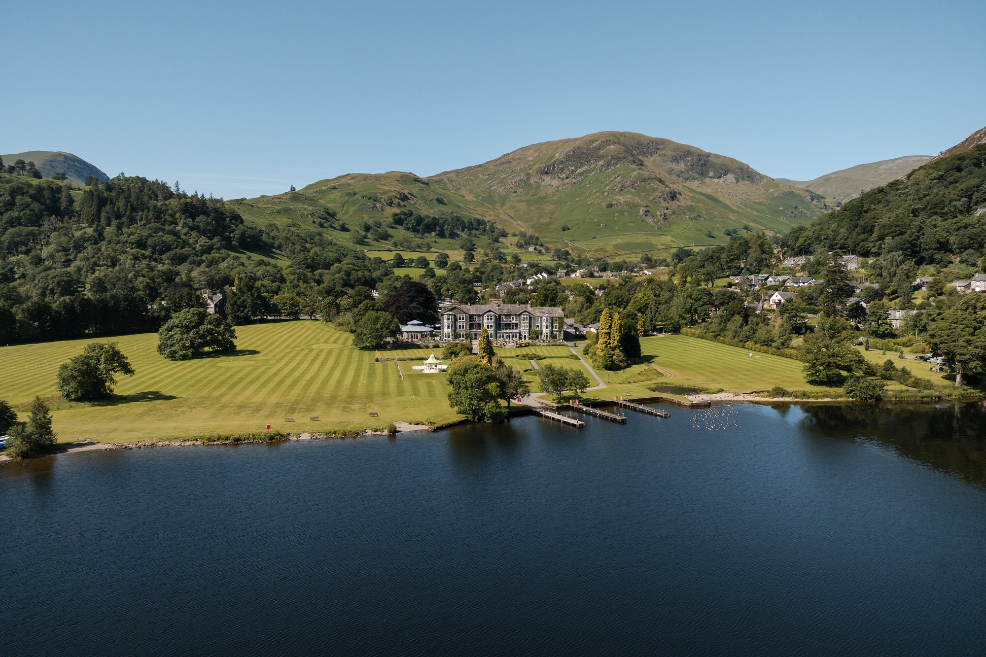 Aerial view of Inn on the Lake beside Ullswater and the surrounding Lake District mountains