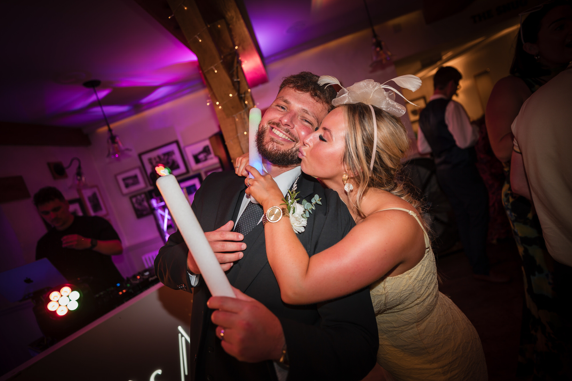 A guest kissing Dan on the cheek during the lively Ramblers Bar party