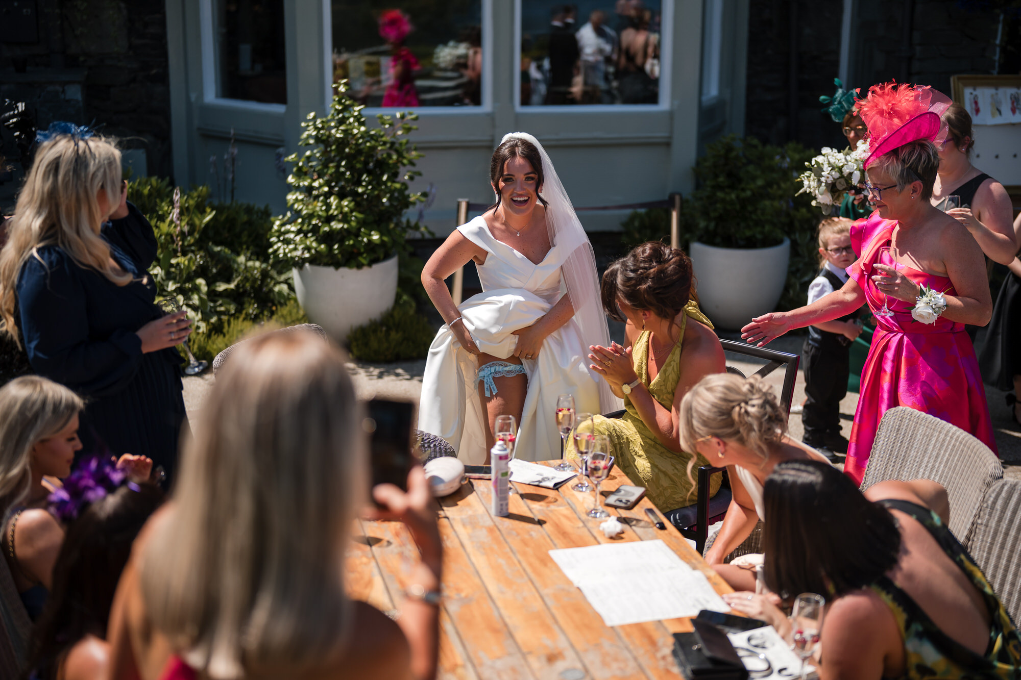 A guest enjoying the relaxed afternoon reception in the gardens
