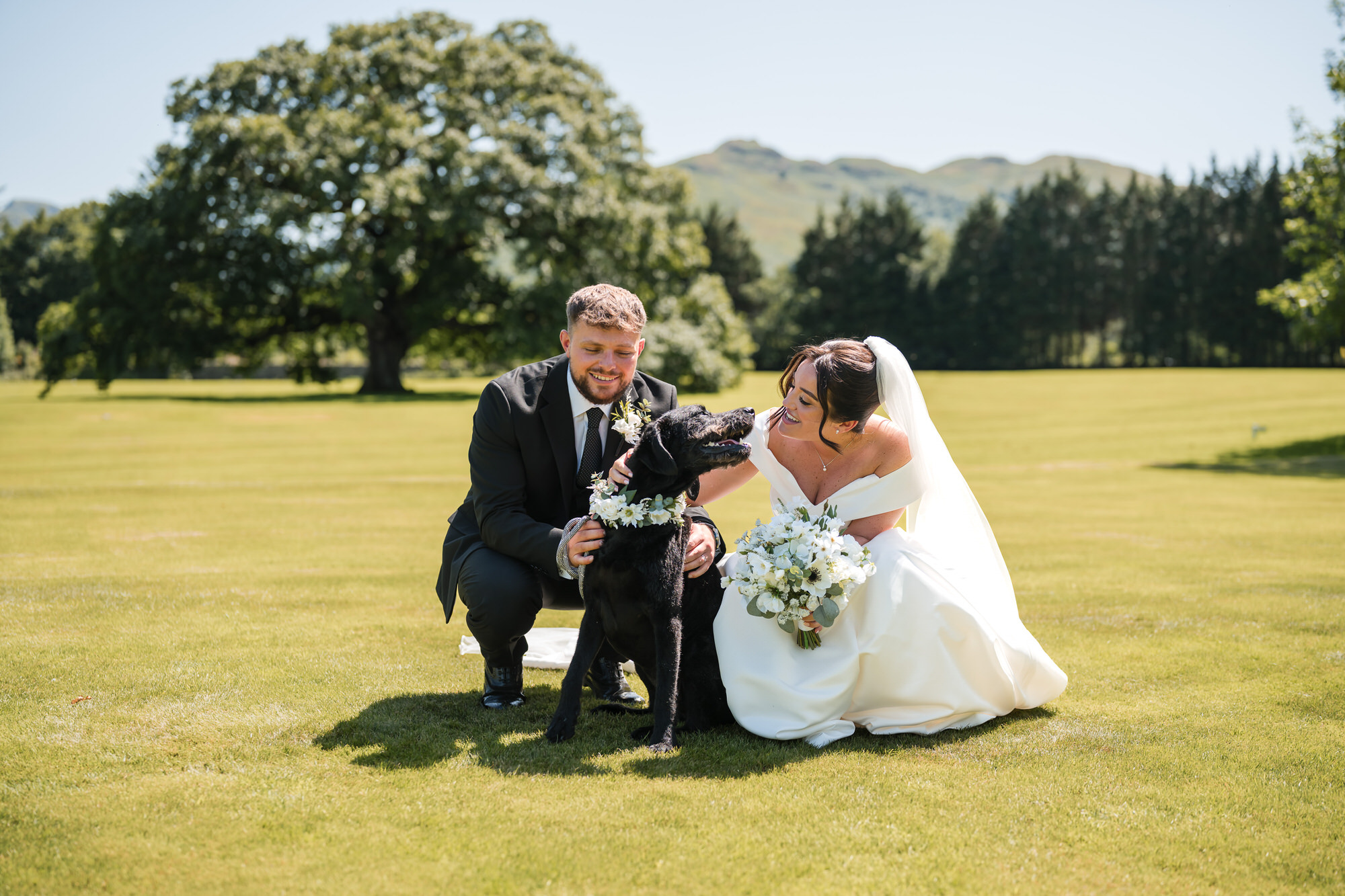 Dan and Amy laughing with Nellie during their drinks reception