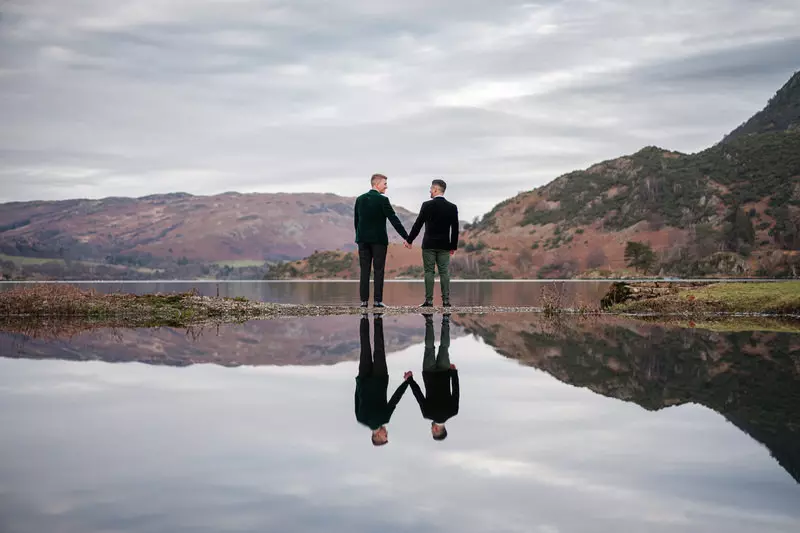 Gay wedding couple portrait by a red autumn tree in the Lake District