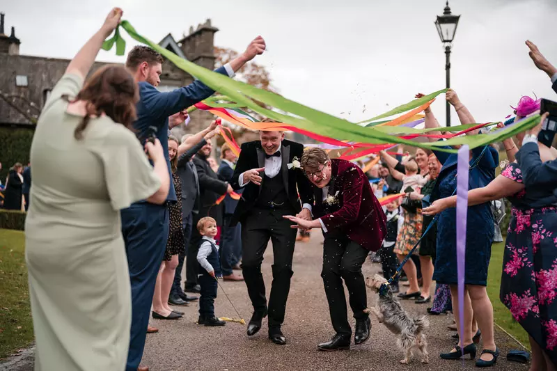 Gay wedding ribbon tunnel celebration at Broadoaks Country House