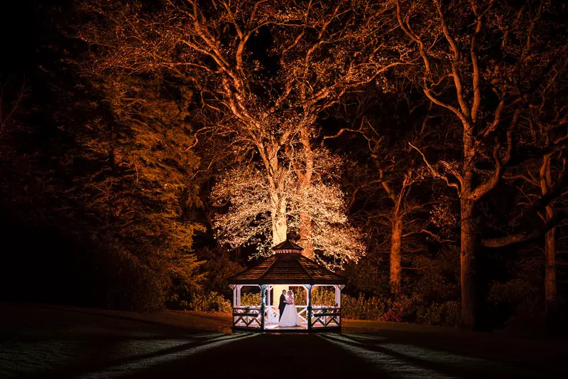 Armathwaite Hall night gazebo portrait Night wedding portrait at Armathwaite Hall beside gazebo and illuminated trees
