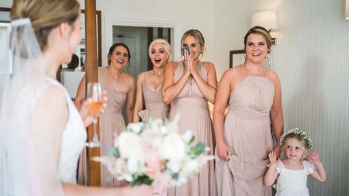 bridesmaids react to seeing the bride at inn on the lake bridesmaids react to seeing the bride at inn on the lake