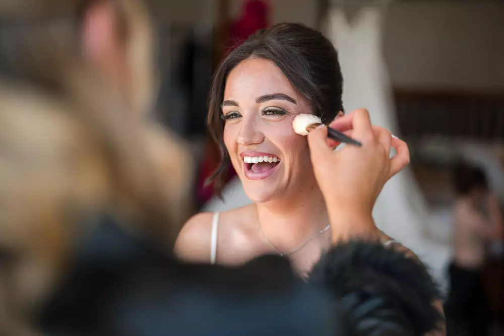 Bridal prep candid moment during makeup