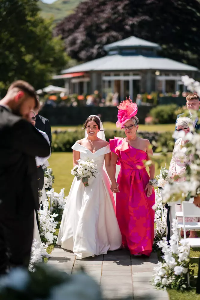Bride arrival for outdoor ceremony at Inn on the Lake