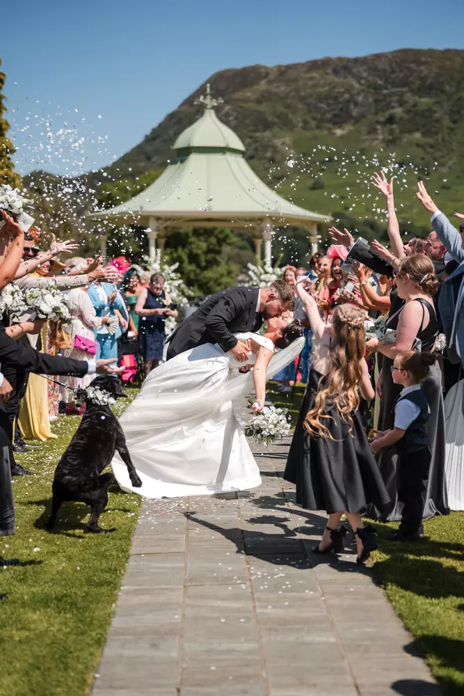 Outdoor wedding confetti moment at Inn on the Lake