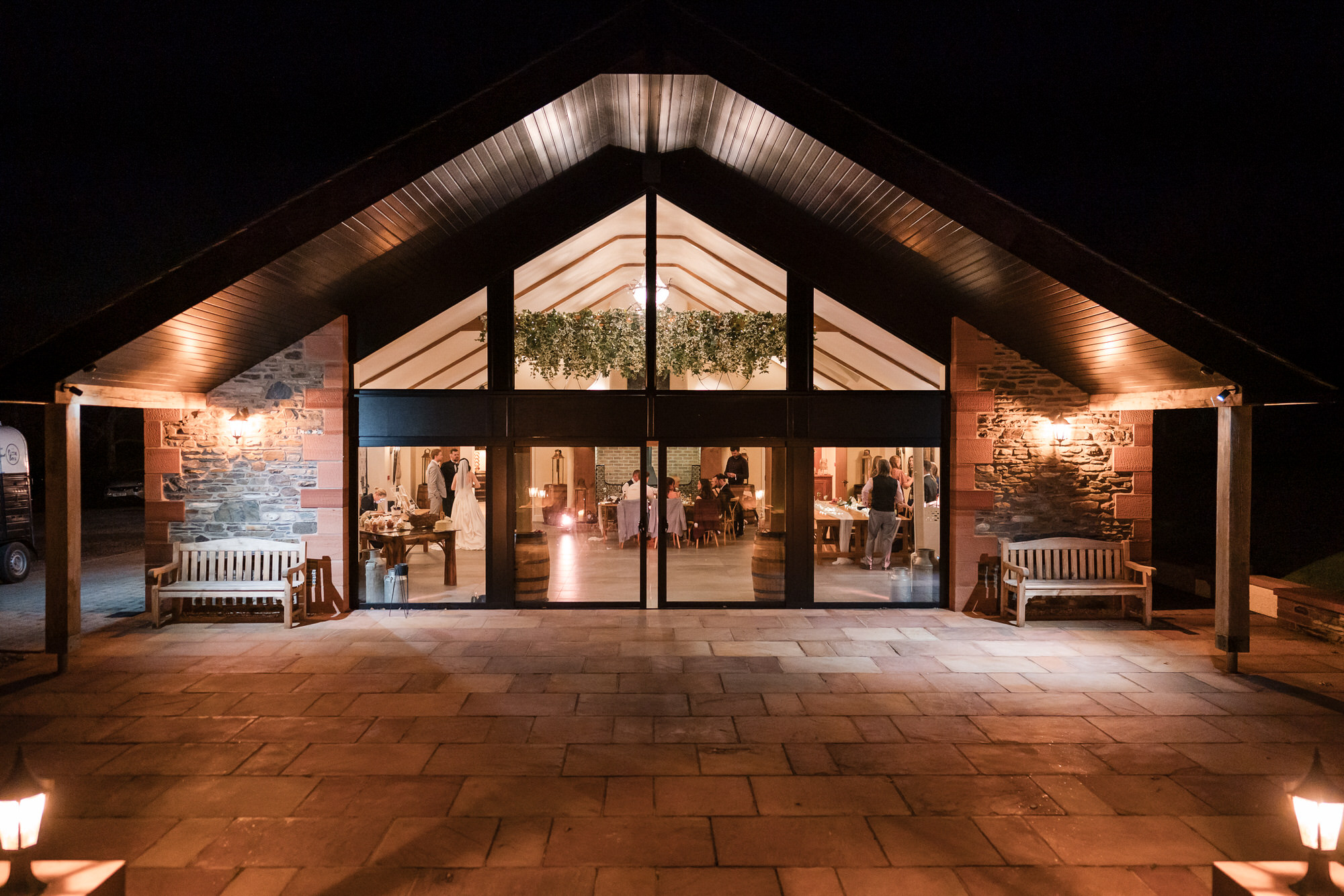 Evening wedding reception inside the barn at New House Farm