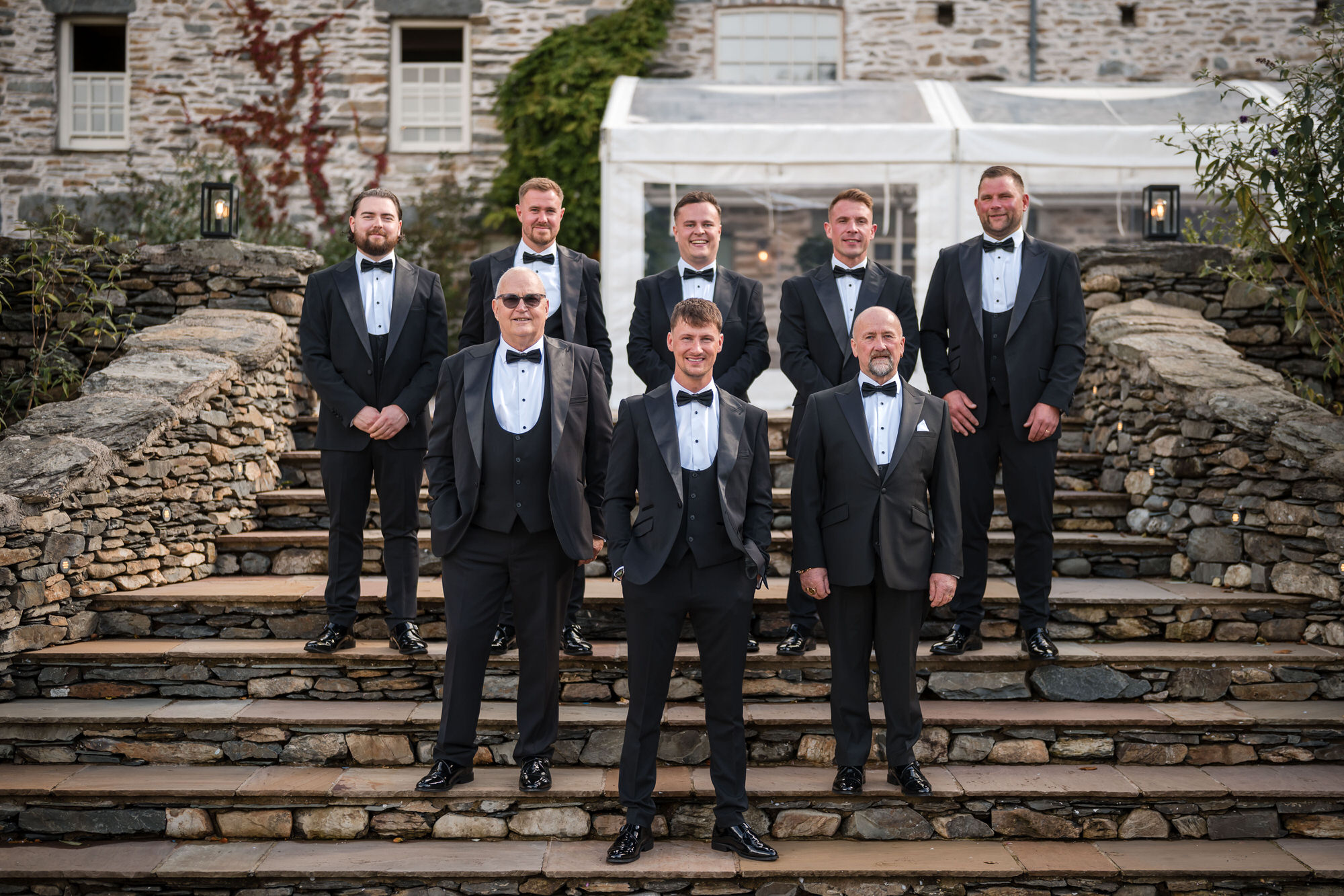 Dan and his groomsmen gathered on the stone steps at Town Head Estate