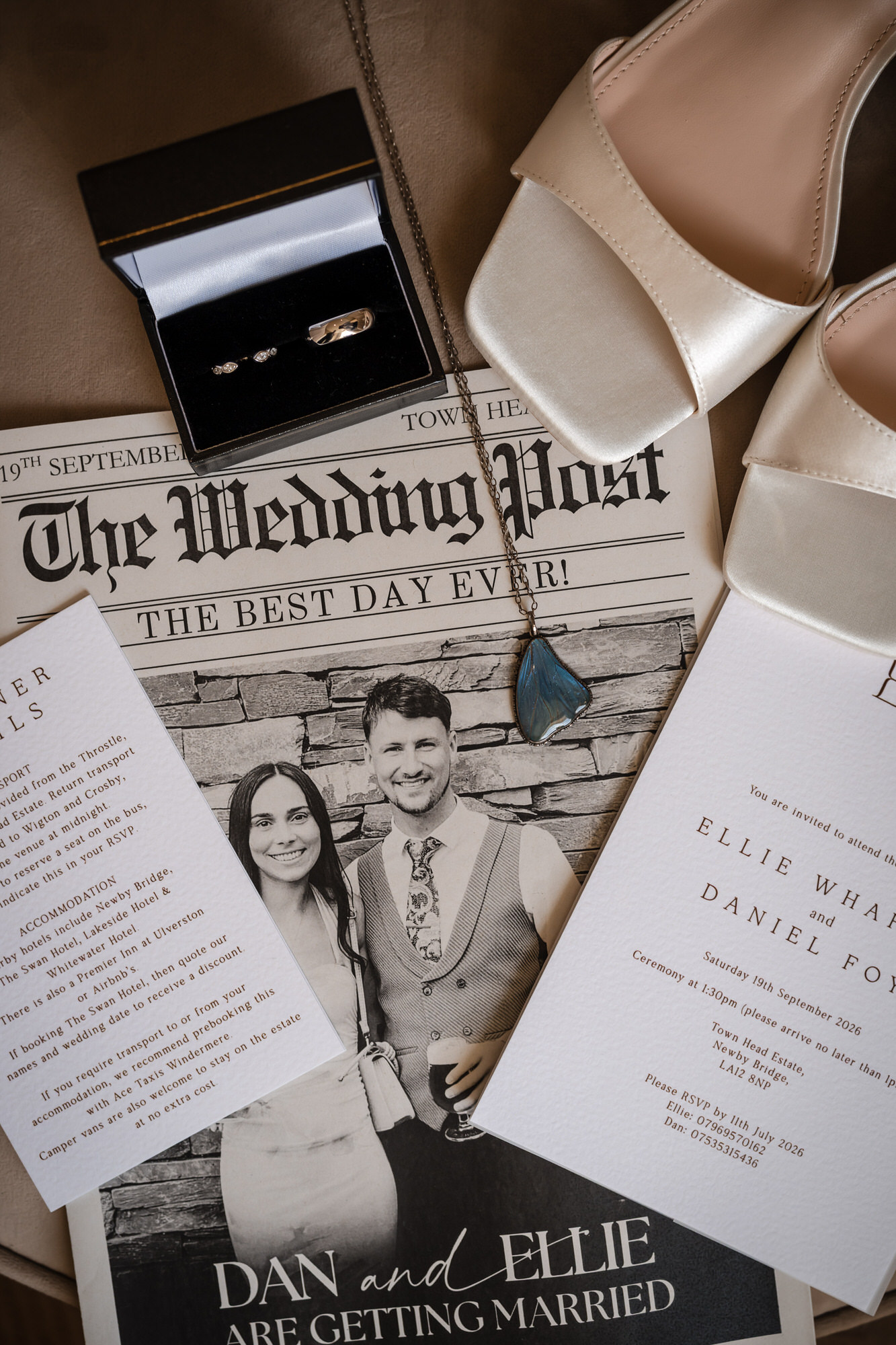 Dan and Ellie’s personalised wedding newspaper alongside bridal details