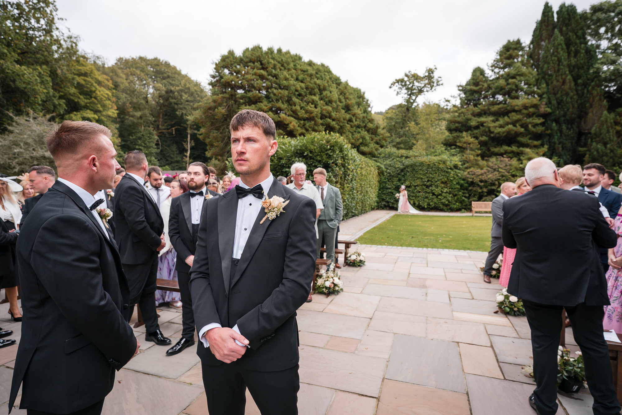 Dan waiting with the groomsmen before the outdoor wedding ceremony