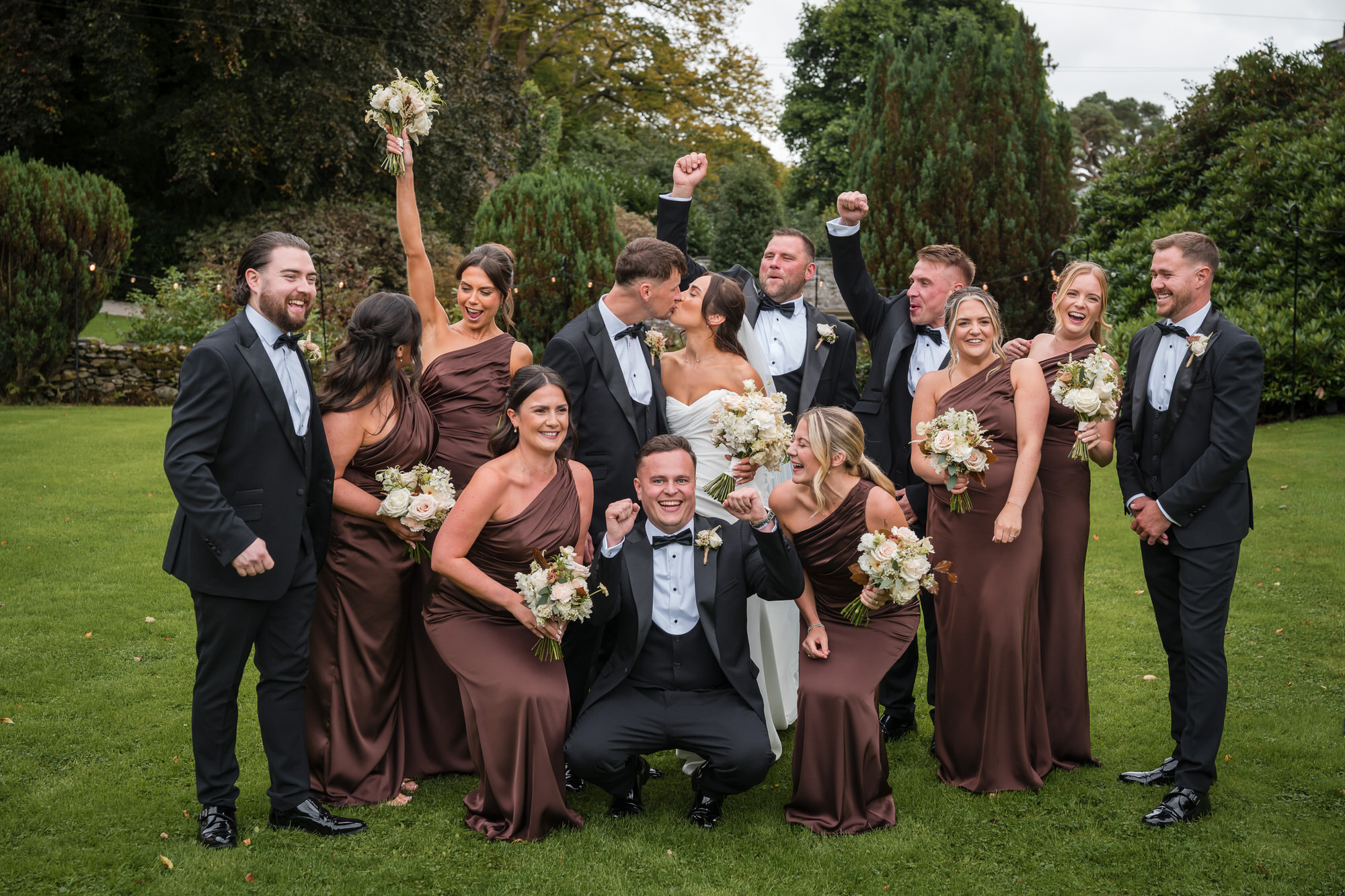 Dan and Ellie celebrating with their lively wedding party