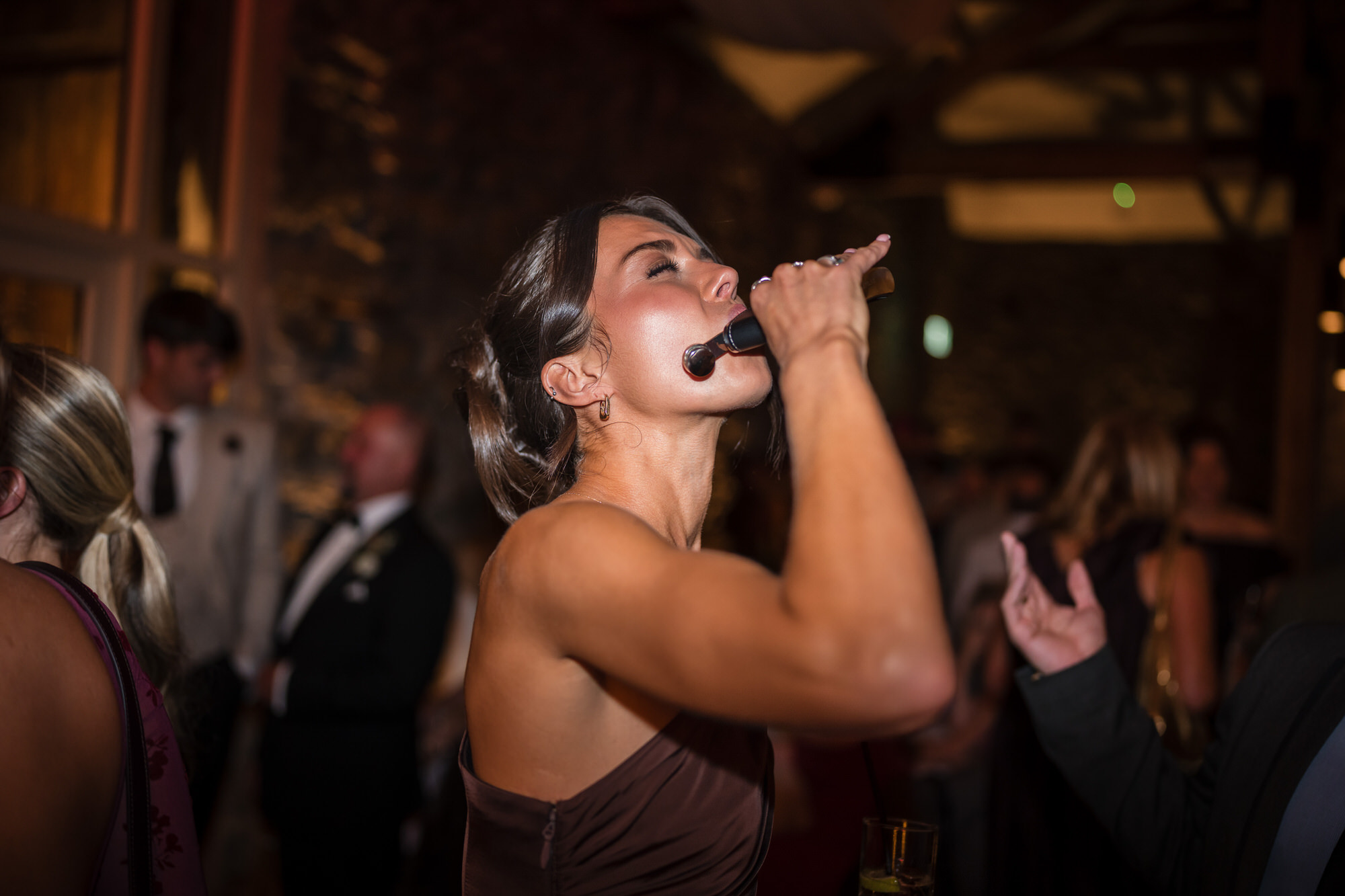 A bridesmaid laughing during the evening celebrations