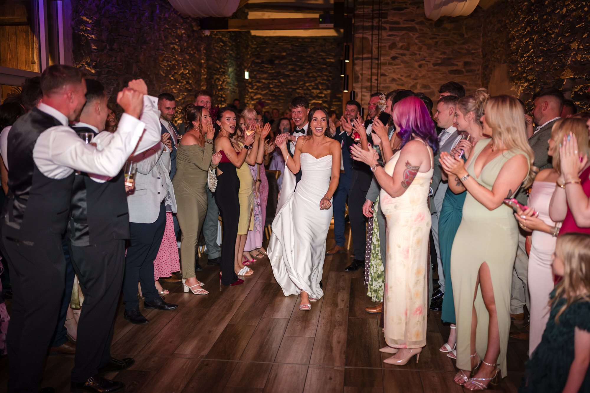 Guests applauding as Dan and Ellie take to the dance floor