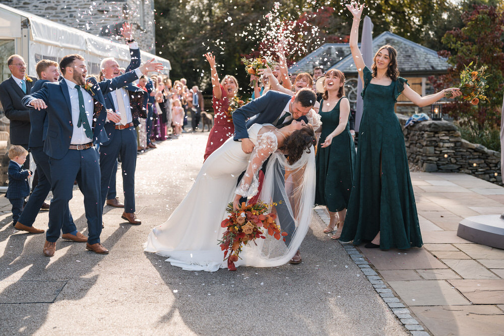 Confetti celebration outside Town Head Estate wedding barn